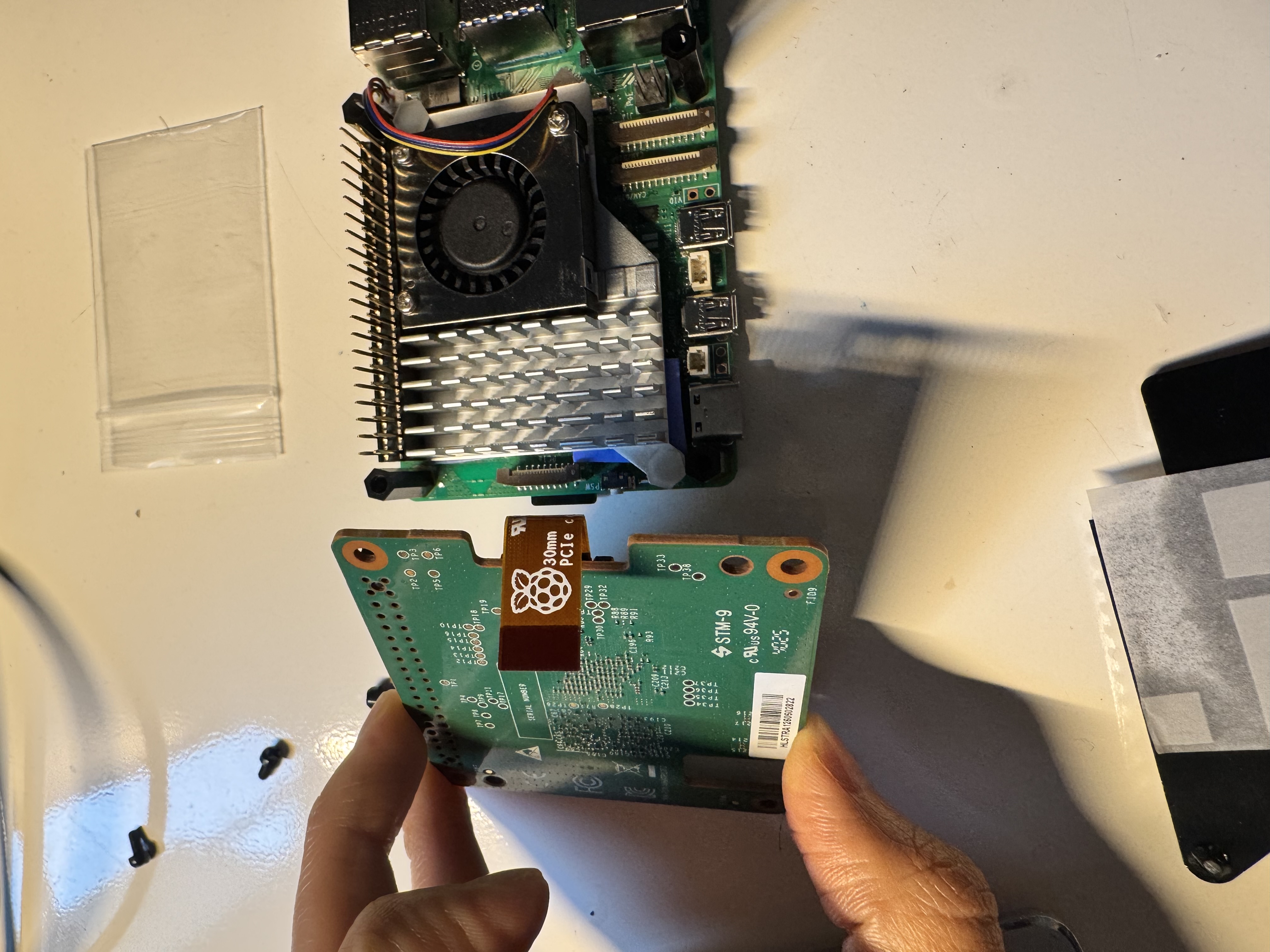HAT being aligned onto the Pi 5